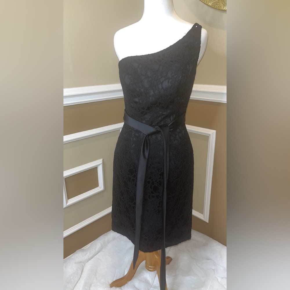 Affairs by Mori Lee Black lace asymmetrical dress with ribbon tie.